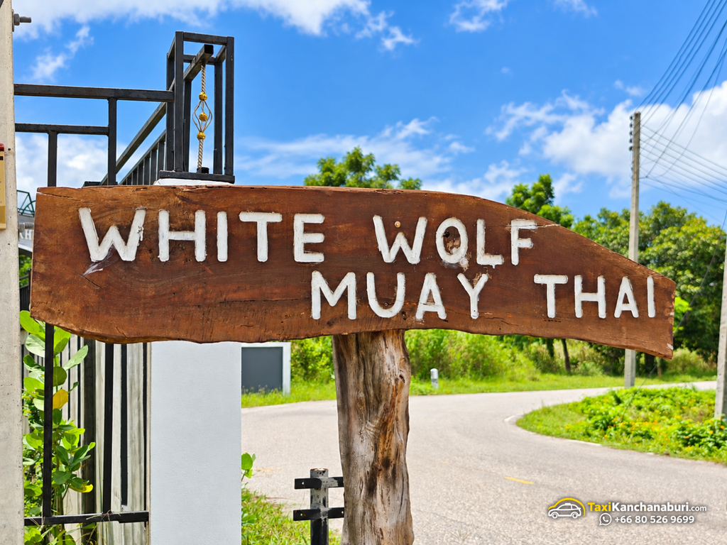 White Wolf Muay Thai Academy entrance sign in Kanchanaburi, Thailand